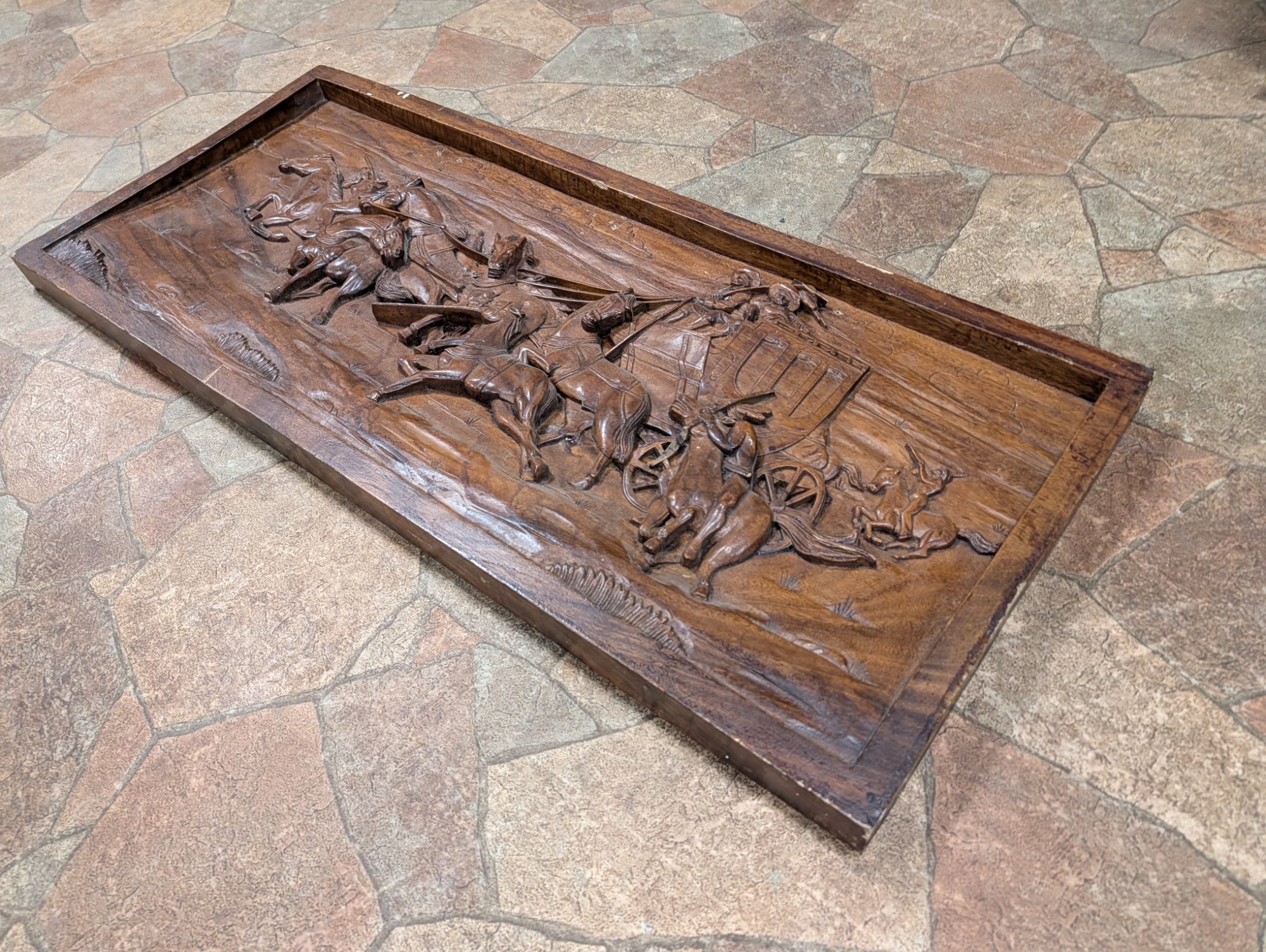 Full angle view of the carving showing depth and dimension of the relief work