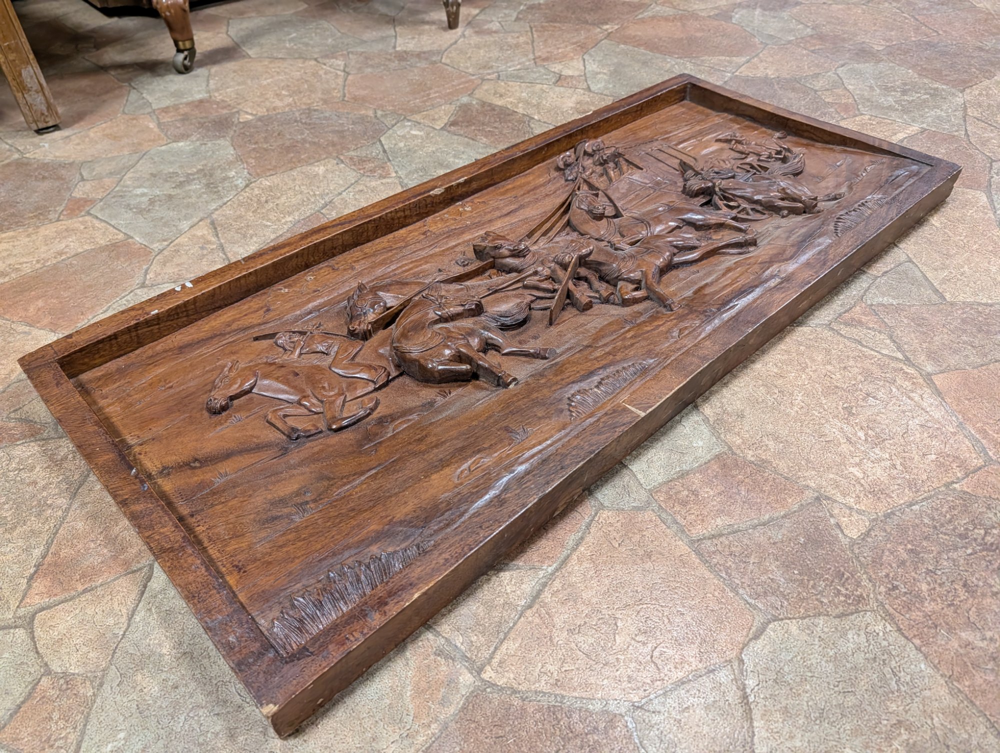 Perspective view showing the three-dimensional quality of the carved figures