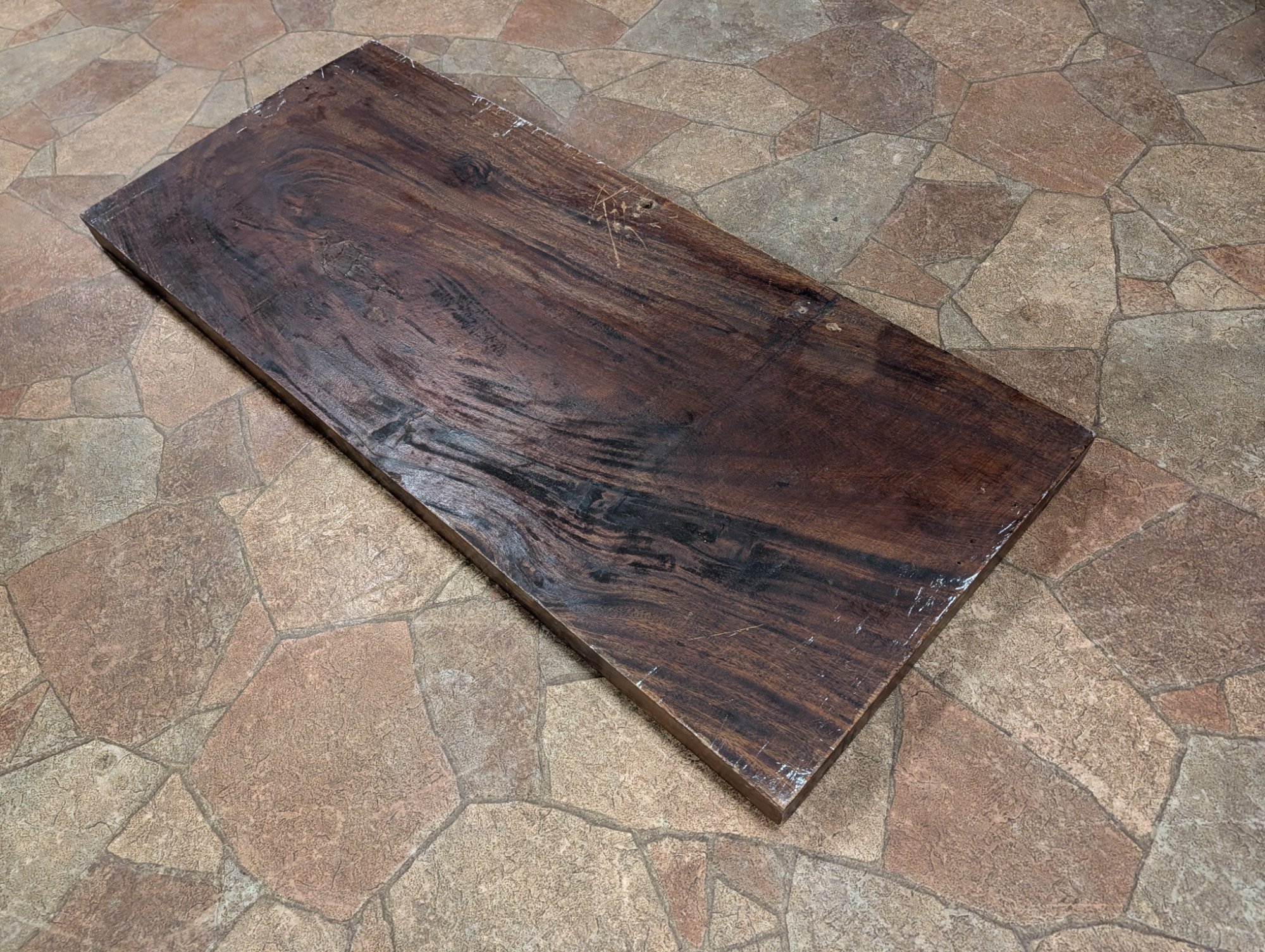 Back perspective revealing the wood grain and age marks